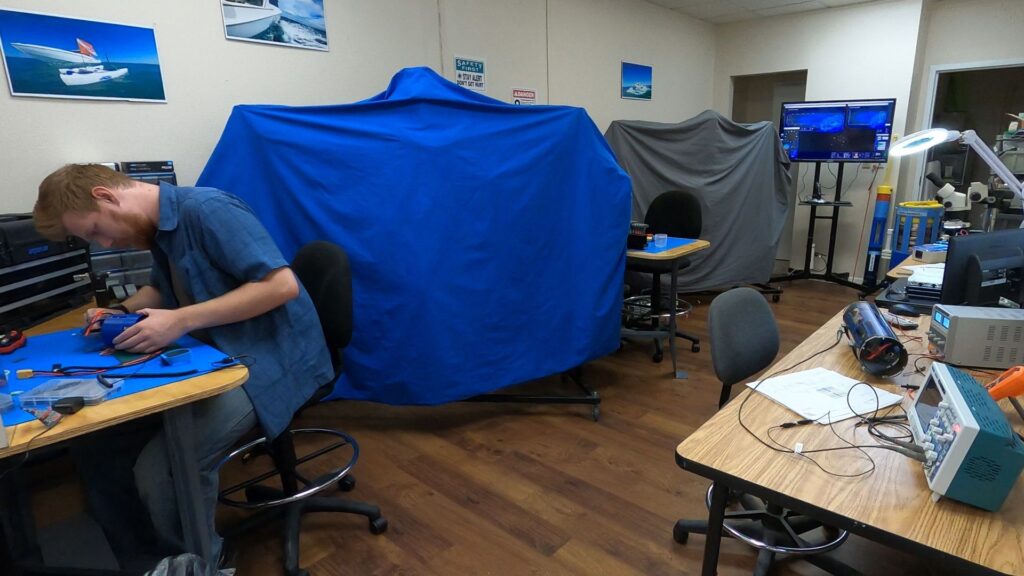 The SeaSearcher lab is outfitted to build and maintain the SeaSearchers and supporting components. Pardon the covers. They are a little modest. Our lab has a dedicated workstation for each SeaSearcher. Yes, there are two SeaSearchers.